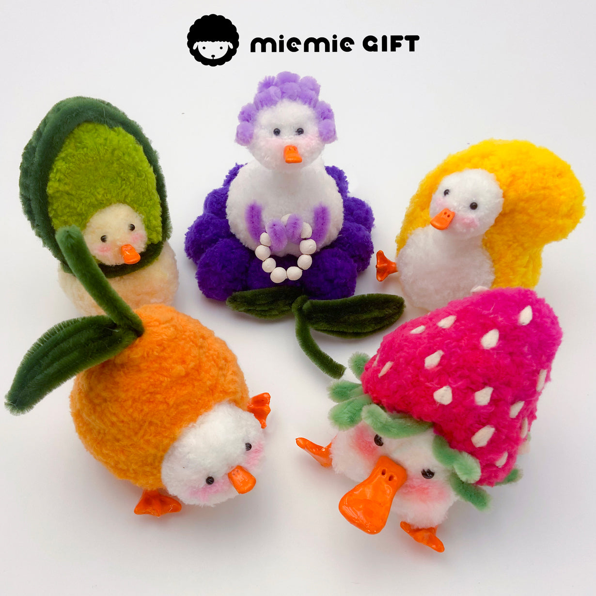 The complete miemie gift Fruit Duck Series — a colorful collection of soft ducks styled as strawberry, avocado, grape, orange, and mango.