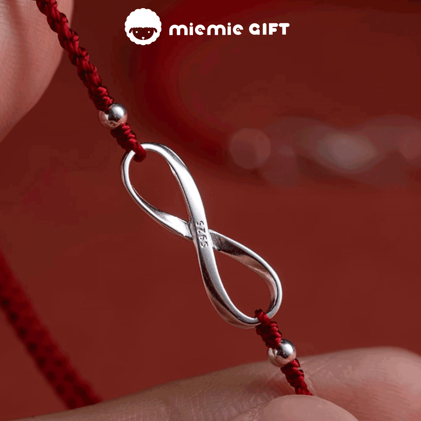 Crafted_with_care_adjustable_red_thread_bracelet_features_ S925_sterling_silver_Möbius_ring's_endless_loop_reflects_the_unbroken_bond
