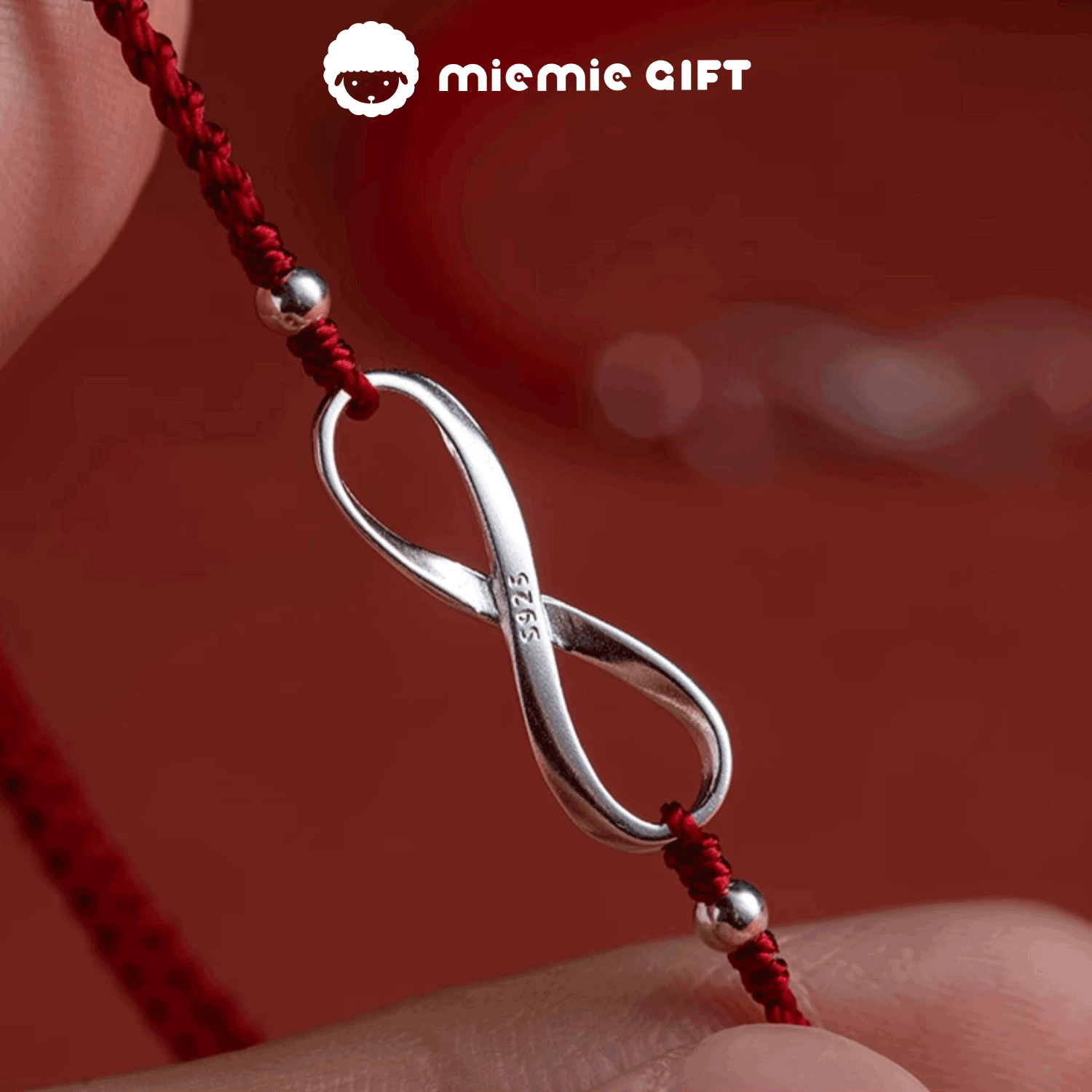 Crafted_with_care_adjustable_red_thread_bracelet_features_ S925_sterling_silver_Möbius_ring's_endless_loop_reflects_the_unbroken_bond
