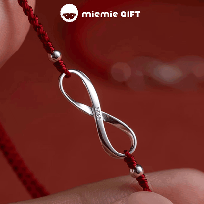 Crafted_with_care_adjustable_red_thread_bracelet_features_ S925_sterling_silver_Möbius_ring's_endless_loop_reflects_the_unbroken_bond