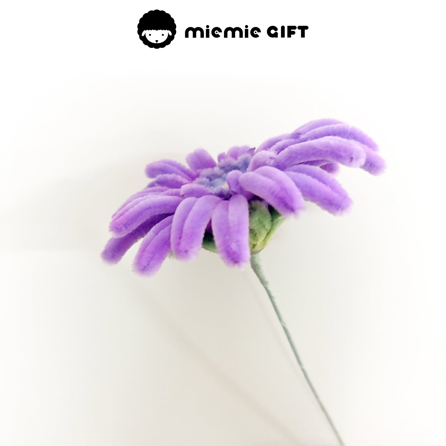 Artistic purple frangipani flower made using pipe cleaners, great for home decoration and DIY craft lovers.