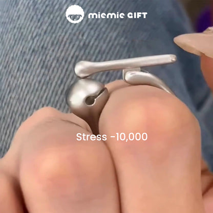 Close-up of the Wooden Fish Silver Ring being tapped, with the text 'Stress -10,000,' showcasing its calming and stress-relief functionality, crafted from 925 sterling silver by MieMie Gift.